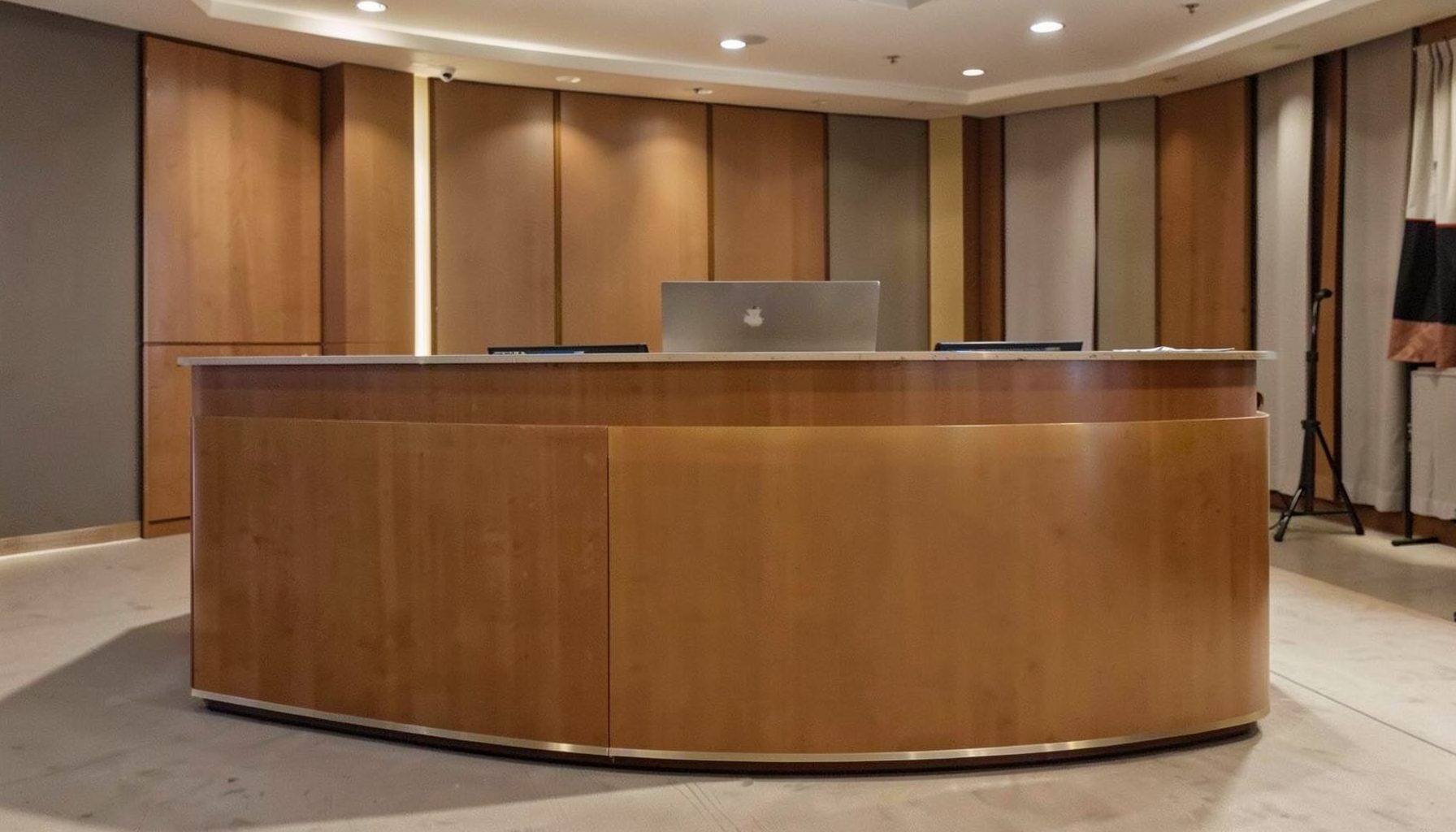 Warm brown and gold toned banner evoking a professional conference registration desk atmosphere